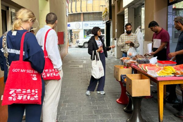 Dubai Souks Iftar tour - Tour Guide buys snacks for Iftarjpg